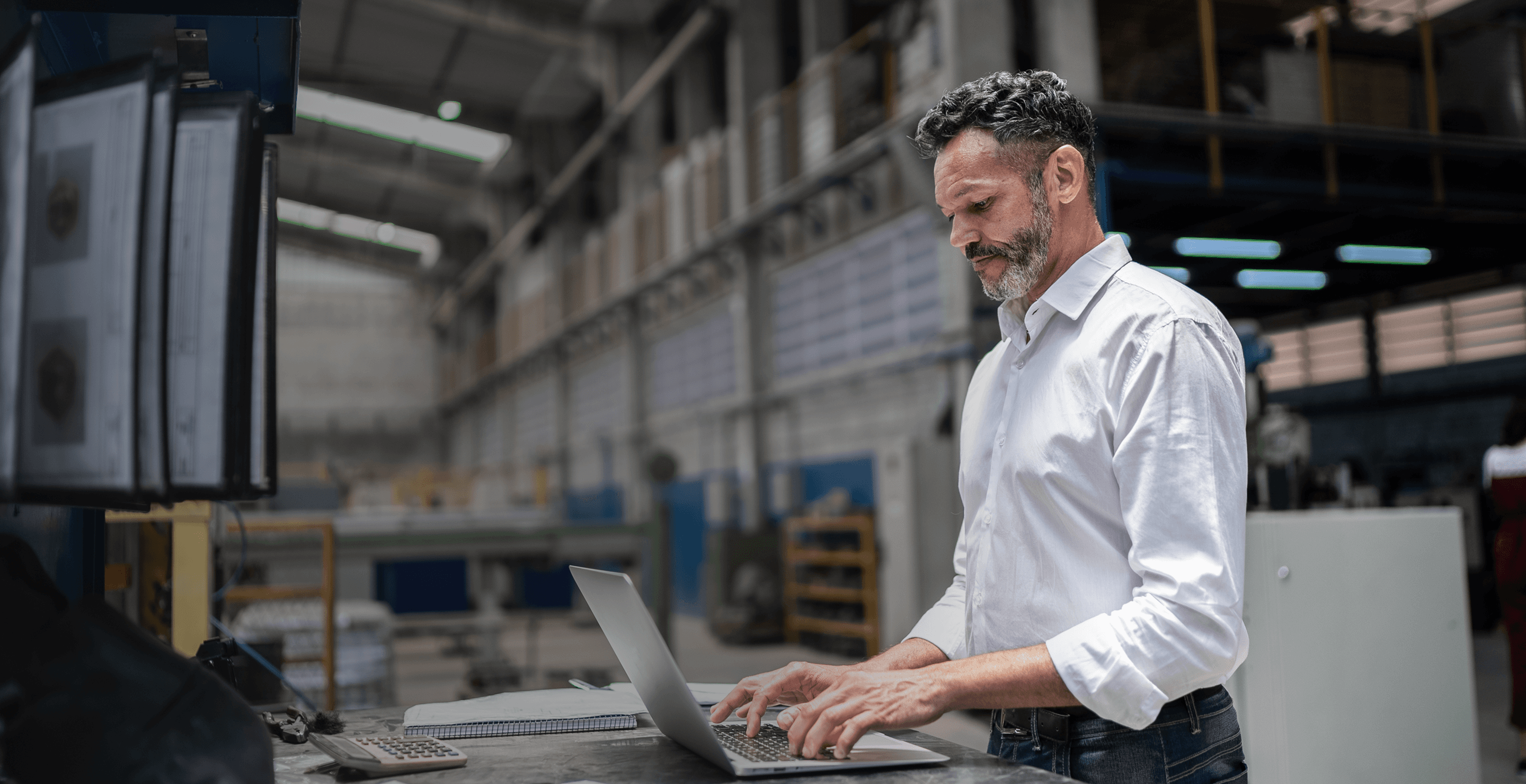 Two shopkeepers taking inventory on tablets in a shop